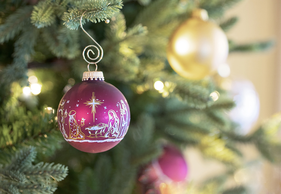 Original Christmas ornament of a golden Christian nativity scene